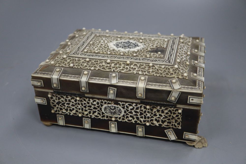 A 19th century Southern Indian horn and ivory mounted trinket box, height 7.5cm and a similar card case